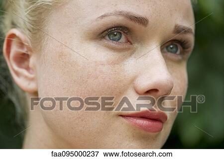 Stock Photo - Face of young woman. Fotosearch