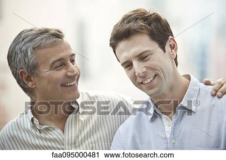 Father and adult son, portrait View Large Photo Image Stock Image - Father and adult son, portrait. Fotosearch
