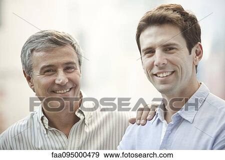 Stock Photo - Father and adult son, portrait. Fotosearch