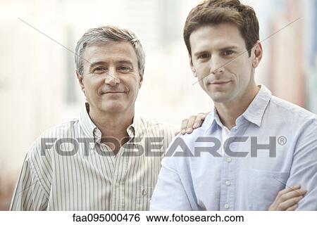 Stock Photograph - Father and adult son, portrait. Fotosearch