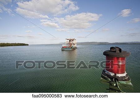 Stock Image - Ferry boat in water. Fotosearch