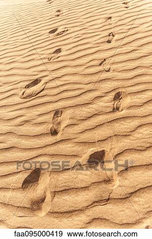 Stock Photo - Footprints in rippled sand. Fotosearch