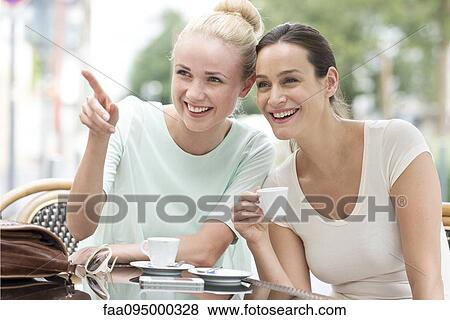 Stock Photo - Friends gossiping. Fotosearch