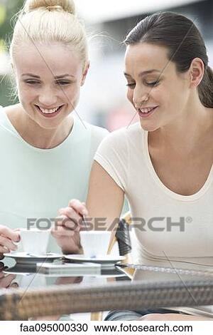 Stock Image - Friends having coffee together. Fotosearch
