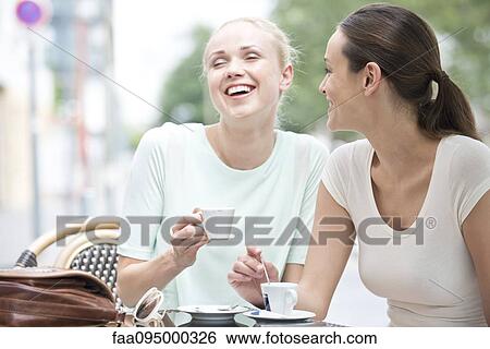 Stock Photograph - Friends having laugh together. Fotosearch
