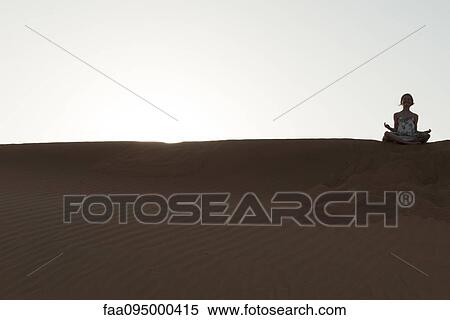 Girl meditating in desert View Large Photo Image Stock Photography - Girl meditating in desert. Fotosearch