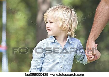 Little boy holding father's hand View Large Photo Image Stock Photo - Little boy holding father's hand. Fotosearch