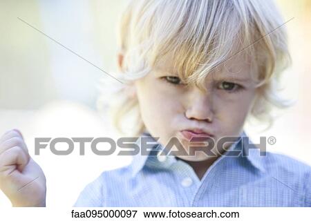 Stock Photo - Little boy pouting. Fotosearch