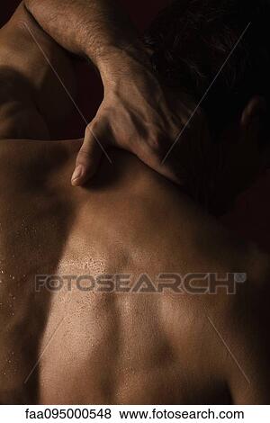 Man with hand on back of neck View Large Photo Image Stock Photo - Man with hand on back of neck. Fotosearch