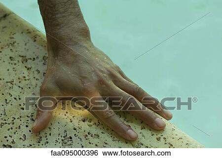 Man's wet hand on side of pool View Large Photo Image Stock Photograph - Man's wet hand on side of pool. Fotosearch