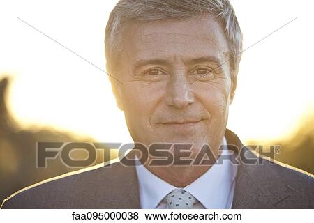 Mature business executive, backlit, portrait View Large Photo Image Stock Photo - Mature business executive, backlit, portrait. Fotosearch