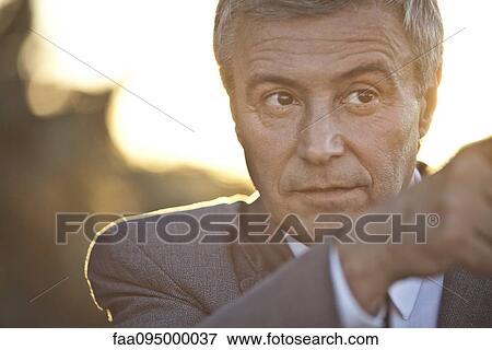 Mature businessman pointing, backlit View Large Photo Image Stock Photo - Mature businessman pointing, backlit. Fotosearch