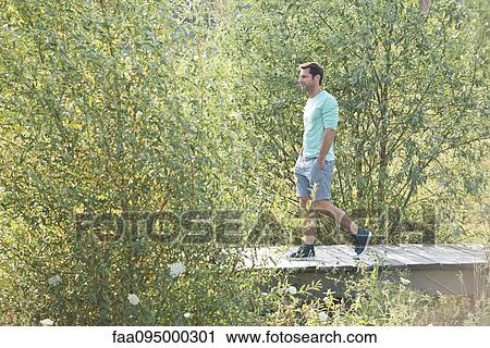 Mature man on countryside walk View Large Photo Image Stock Image - Mature man on countryside walk. Fotosearch