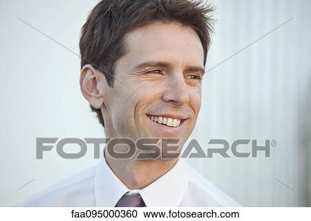 Stock Image - Mid-adult businessman, portrait. Fotosearch