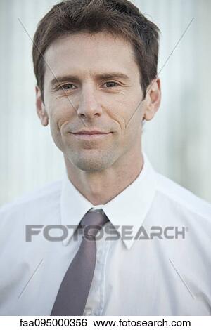 Mid-adult businessman, portrait View Large Photo Image Stock Photograph - Mid-adult businessman, portrait. Fotosearch