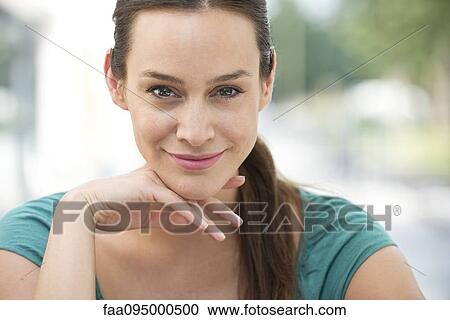 Stock Image - Mid-adult woman, portrait. Fotosearch