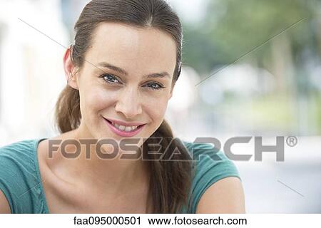 Stock Image - Mid-adult woman, portrait. Fotosearch