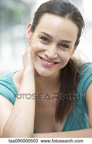 Stock Image - Mid-adult woman, portrait. Fotosearch
