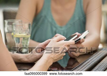 Pairing smartphones using bluetooth to exchange data View Large Photo Image Stock Photo - Pairing smartphones using bluetooth to exchange data. Fotosearch