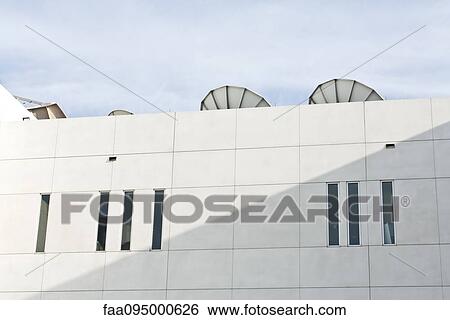 Satellite dishes on top of building View Large Photo Image Stock Photograph - Satellite dishes on top of building. Fotosearch