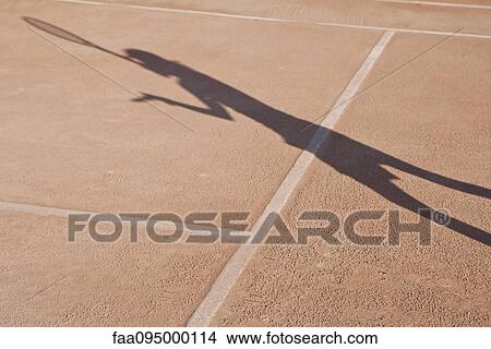 Shadow of person playing tennis View Large Photo Image Picture - Shadow of person playing tennis. Fotosearch