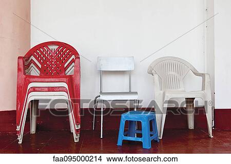 Stack of plastic chairs View Large Photo Image Picture - Stack of plastic chairs. Fotosearch