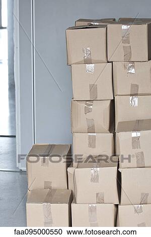 Stock Image - Stacked cardboard boxes. Fotosearch