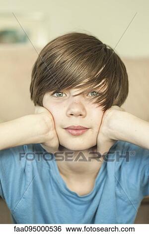 Stock Photograph - Teenage boy, portrait. Fotosearch