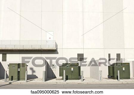 Stock Photography - Transformers by side of building. Fotosearch