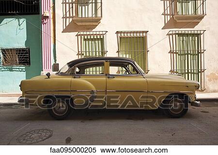 Stock Photography - Vintage car parked on street. Fotosearch