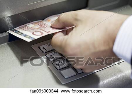 Withdrawing cash from ATM View Large Photo Image Picture - Withdrawing cash from ATM. Fotosearch