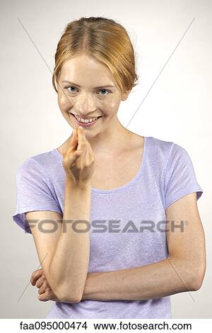 Picture - Woman beckoning with her finger, portrait. Fotosearch