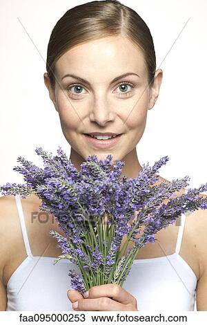 Woman holding bouquet of fresh lavender, portrait View Large Photo Image Stock Image - Woman holding bouquet of fresh lavender, portrait. Fotosearch