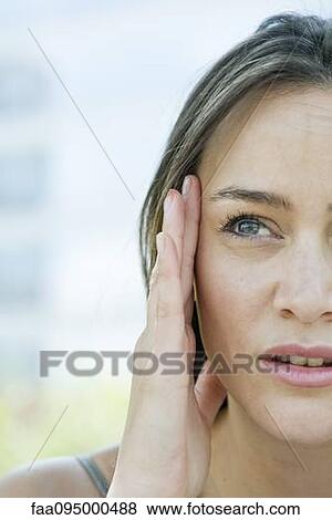 Woman rubbing temples, cropped View Large Photo Image Stock Photo - Woman rubbing temples, cropped. Fotosearch
