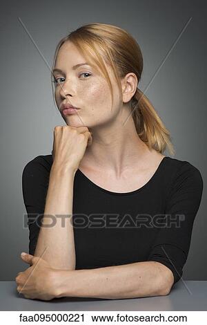 Woman sulking, portrait View Large Photo Image Stock Image - Woman sulking, portrait. Fotosearch