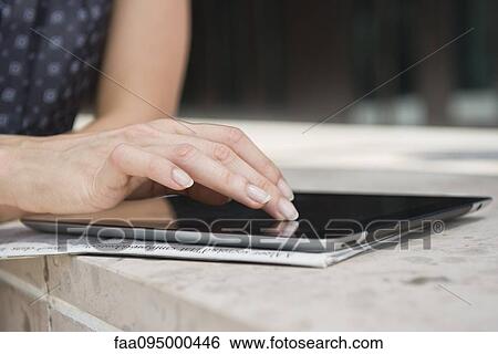 Woman using digital tablet View Large Photo Image Stock Photograph - Woman using digital tablet. Fotosearch