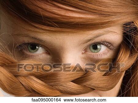 Woman with braid under eyes, close-up View Large Photo Image Picture - Woman with braid under eyes, close-up. Fotosearch