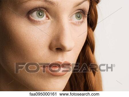 Stock Image - Woman with braided hairstyle, portrait. Fotosearch