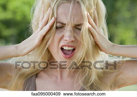 Woman with head in hands, screaming View Large Photo Image Stock Photo - Woman with head in hands, screaming. Fotosearch