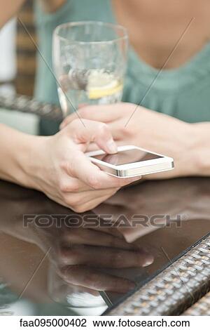 Woman with smartphone View Large Photo Image Stock Image - Woman with smartphone. Fotosearch