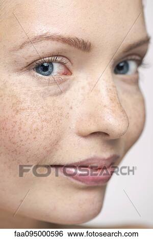 Young woman, close-up portrait View Large Photo Image Stock Photograph - Young woman, close-up portrait. Fotosearch