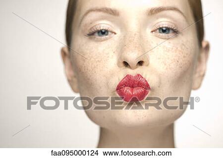 Young woman puckering lips, portrait View Large Photo Image Picture - Young woman puckering lips, portrait. Fotosearch