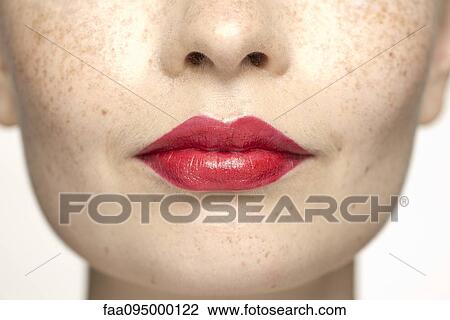 Young woman wearing bright red lipstick, portrait View Large Photo Image Stock Image - Young woman wearing bright red lipstick, portrait. Fotosearch