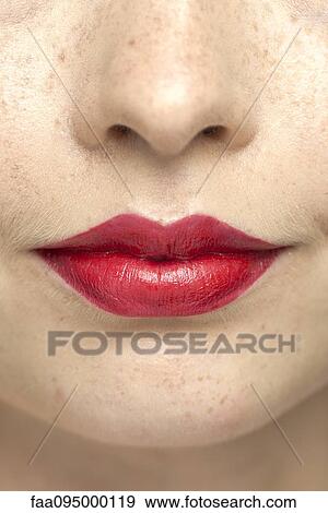 Young woman wearing bright red lipstick, portrait View Large Photo Image Stock Photo - Young woman wearing bright red lipstick, portrait. Fotosearch