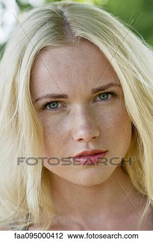 Young woman with blonde hair View Large Photo Image Stock Image - Young woman with blonde hair. Fotosearch