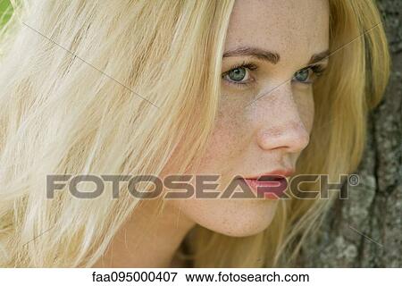 Stock Photo - Young woman with blonde hair. Fotosearch