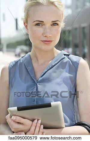 Young woman with digital tablet View Large Photo Image Stock Photo - Young woman with digital tablet. Fotosearch