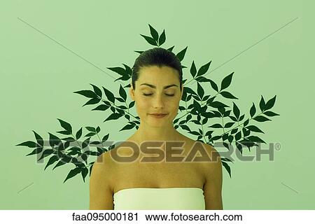 Young woman with eyes closed, leaf pattern in background View Large Photo Image Stock Image - Young woman with eyes closed, leaf pattern in background. Fotosearch