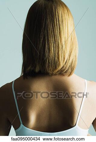 Picture - Young woman with shoulder length hair, rear view. Fotosearch