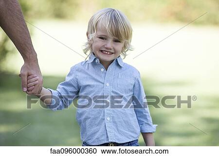 Boy holding father's hand View Large Photo Image Stock Image - Boy holding father's hand. Fotosearch